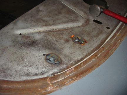 Driver hinge welded to package tray