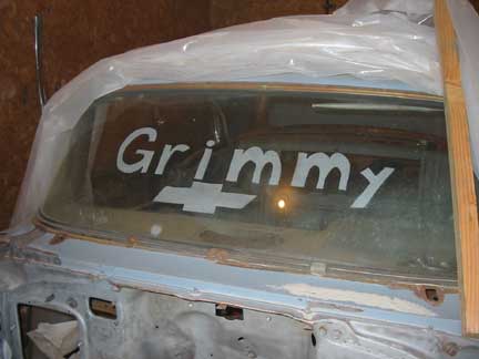 Name sandblasted in windshield