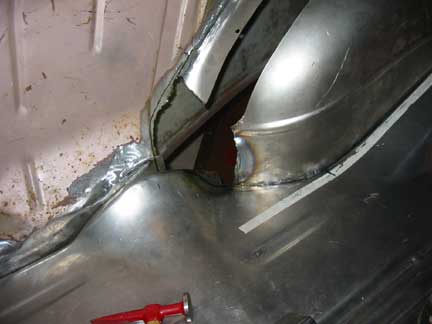 Rear of wheel well in trunk