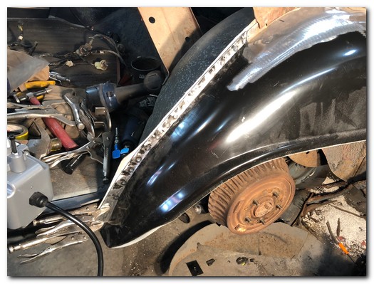 Pinch weld spot welded